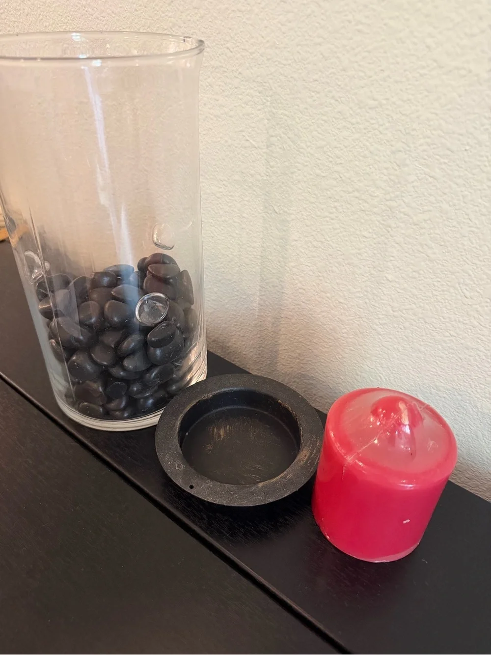 Glass Hurricane Candle Holder with Black Stones and Red Candle
